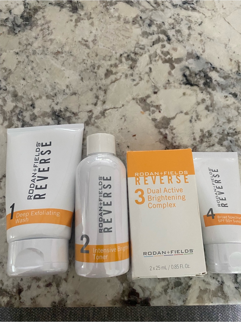Rodan + Fields REVERSE Brightening Set - White and Orange Accents